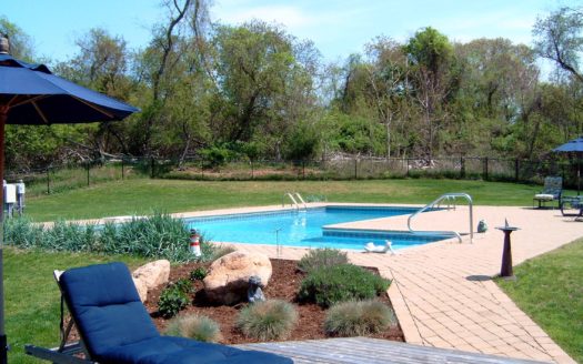 A landscape design with a swimming pool