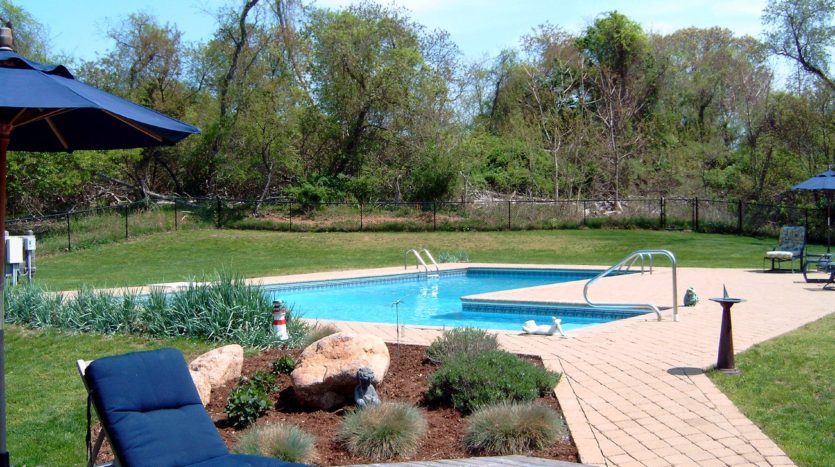 A landscape design with a swimming pool