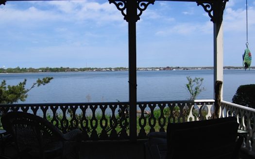 A view of the bay from a dark porch
