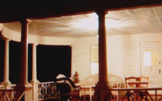 A view of a porch at night