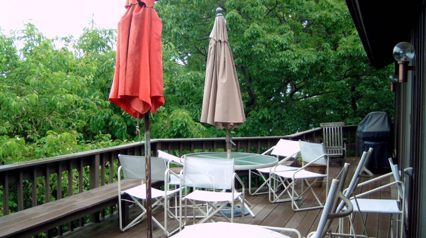 Tables with folded umbrellas